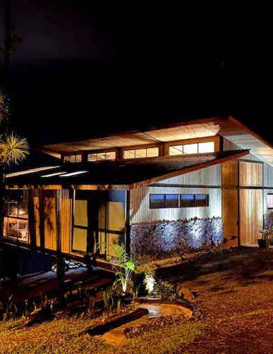 Crystal Cabin Cerro Azul surrounded by lush greenery 01